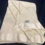 Faribo Cream Wool Blanket W/ Satin Edge Twin 68 X 90 Inch. Fixed Price $35.00.